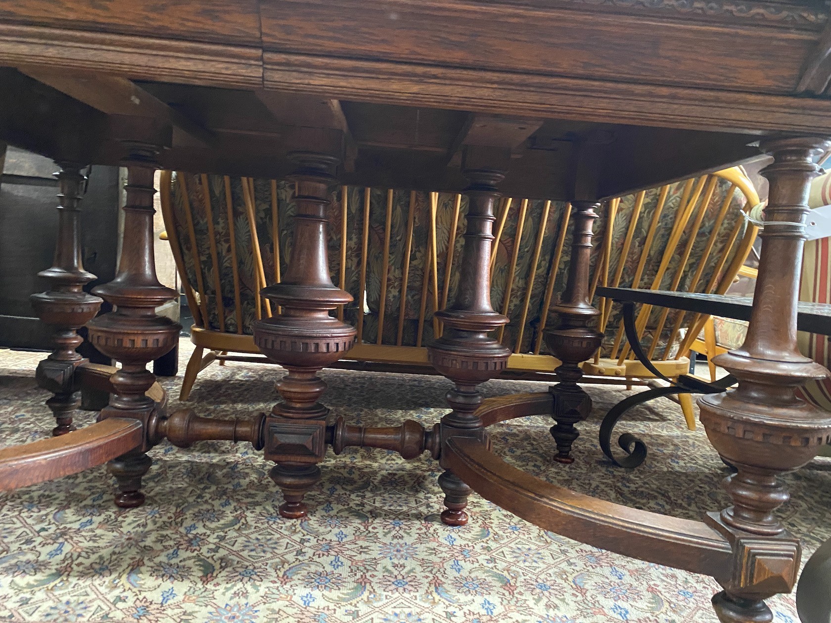 A late 19th / early 20th century French oak extending dining table, (one spare leaf) length 125cm, depth 99cm, height 77cm